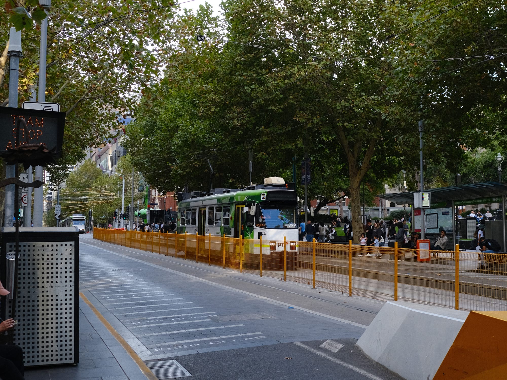 A Melbourne tram at a tram stop in Melbourne. 