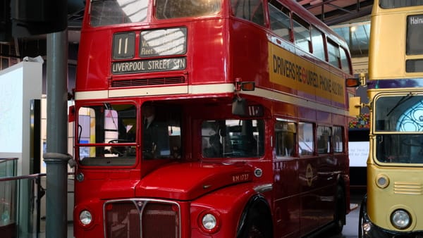 A bright red London double decker bus from the 1960s in the London Transport Museum